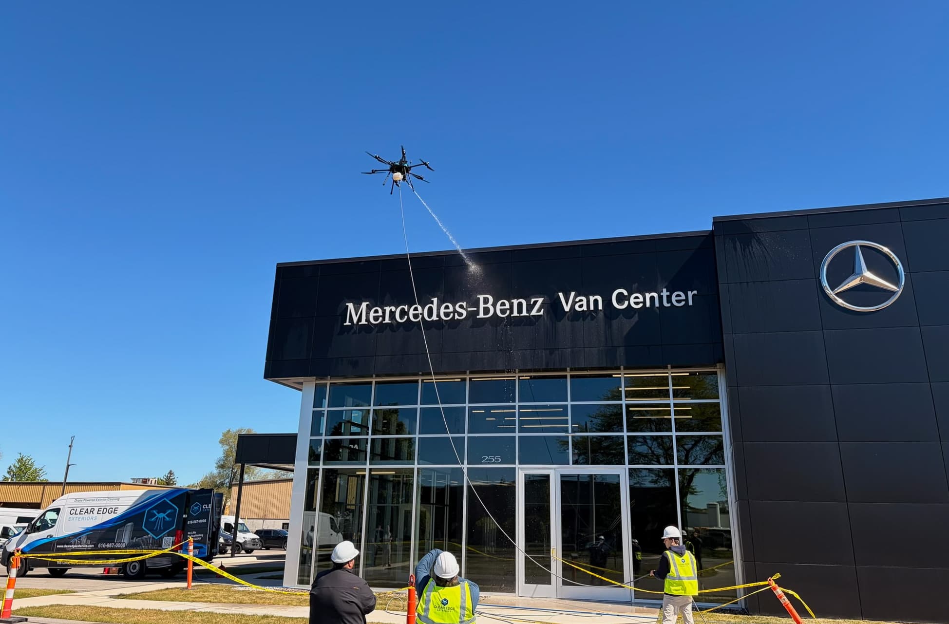 Clear Edge tethered drone cleaning the facade of the Mercedes-Benz Van Center